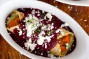 spiced carrot and herbed hazelnut chevre filled roasted garlic and chive buttermilk corn tortilla enchiladas with roasted beet, tomatillo and garlic sauce